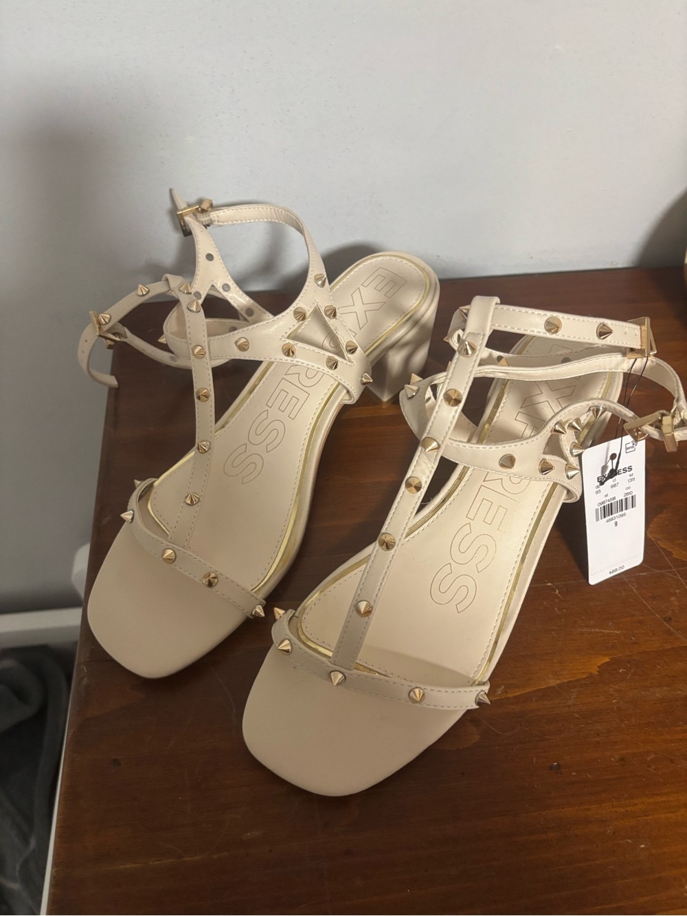 Express Cream Studded T-Strap Sandals with Gold Accents